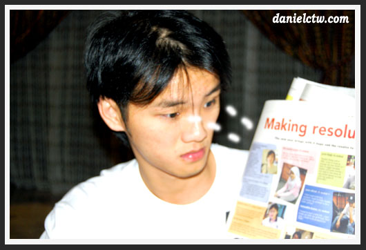 Me Looking at The Star Newspaper